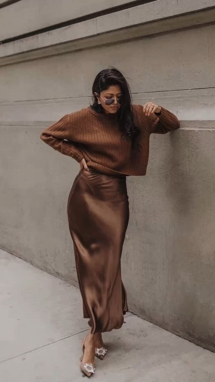 Brown knit sweater with a matching silk skirt